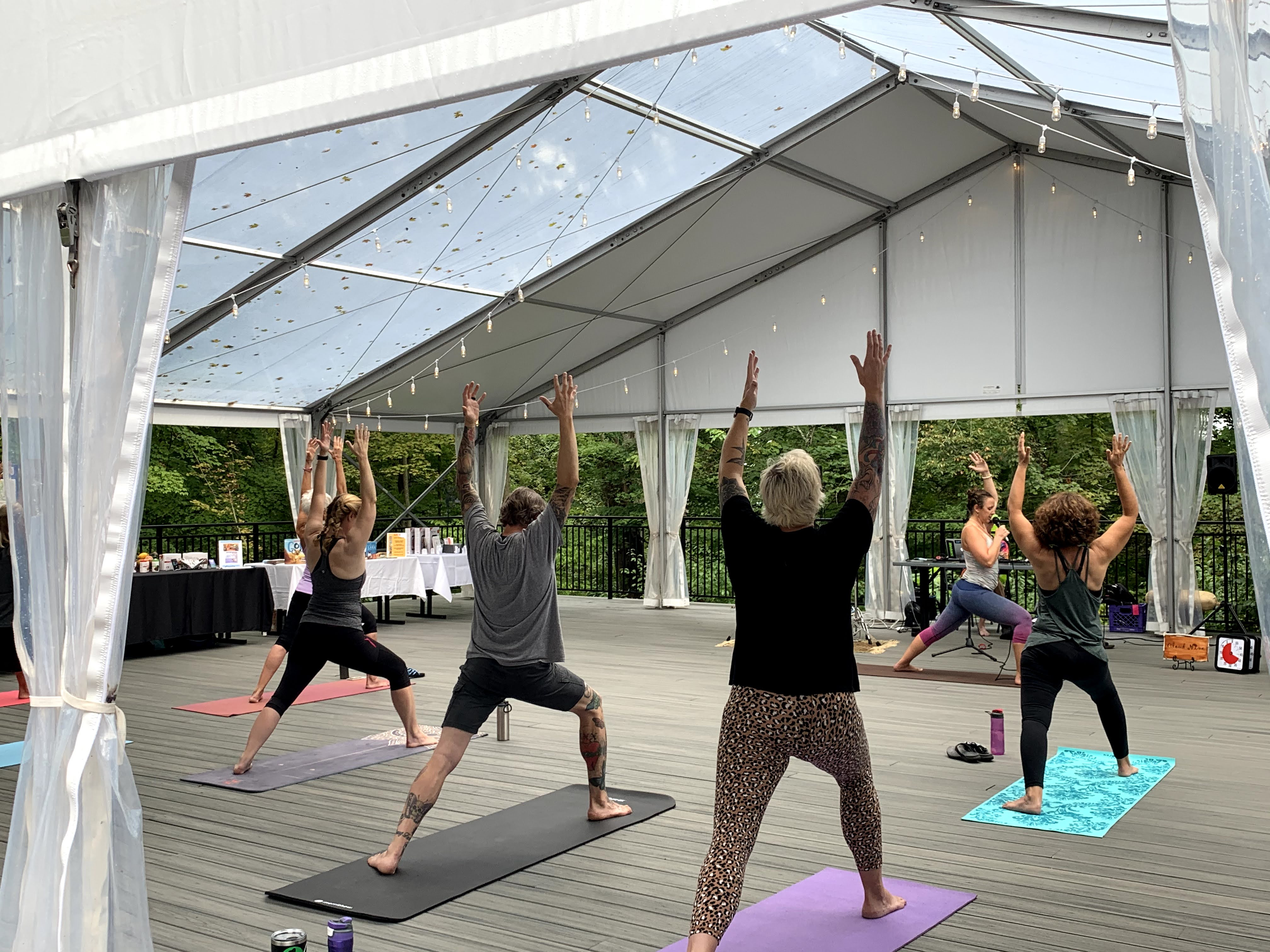 Image of people doing yoga on the tented Tritsch Terrace 